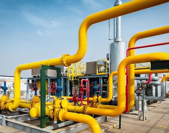 Utility piping at an oil and gas facility